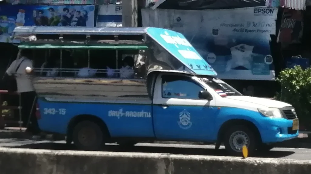 Chonburi songthaew example parked on a street. This image does not confirm a Bangsaen route.